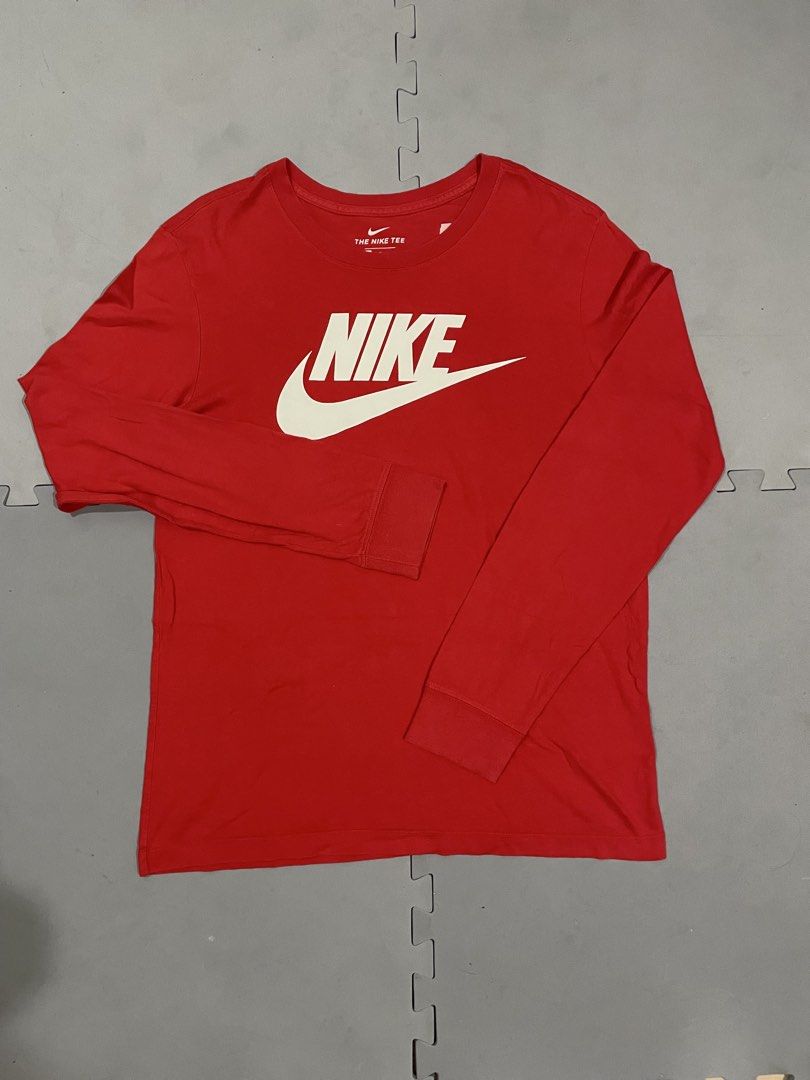 Nike Red Long Sleeve T-Shirt (Category: Tshirts & Polo Shirts ) located in Lapu Lapu. Submitted by mackoy221524 (Listing ID 1463404527, Image 1). Description: - Classic red Nike long sleeve t-shirt - Features iconic white Nike logo on the chest - Made from comfortable, breathable material - Perfect for casual outings or athletic activities - Easily pairs with jeans, shorts, or athletic bottoms.
