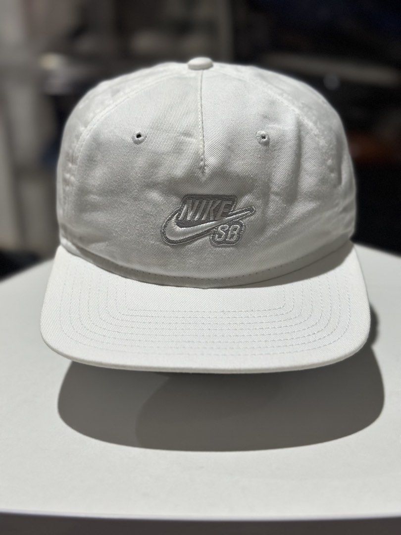 Nike SB White Cap (Category: Caps & Hats) located in Daet. Submitted by thrifthings2018 (Listing ID 1463458689, Image 2). Description: - Classic white Nike SB cap - Features embroidered Nike SB logo on the front - One size fits all for a comfortable fit - Ideal for everyday casual wear.
