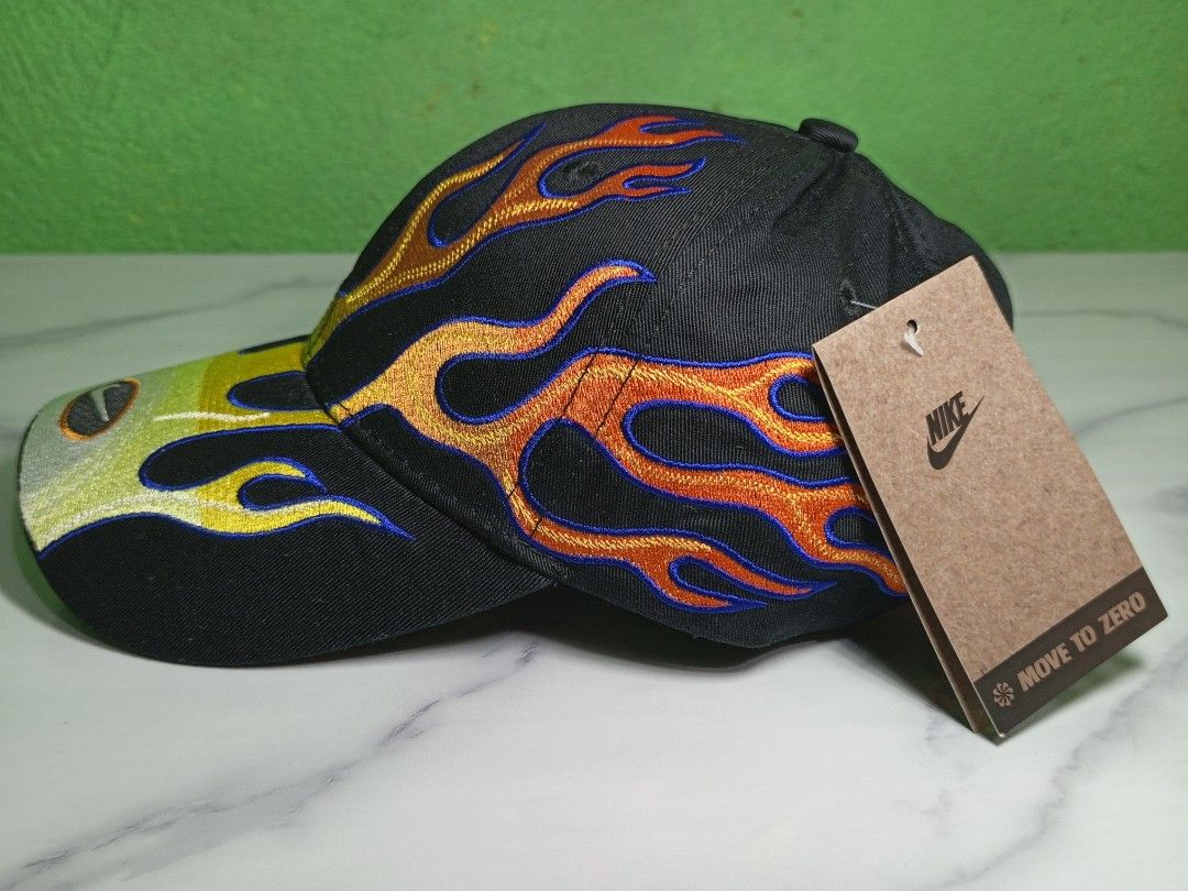 Nike Structured OG Flame Club Cap (High quality Replica) (Category: Caps & Hats) located in Dasmarinas. Submitted by nifty_n00k (Listing ID 1463327120, Image 2). Description: - Black Nike cap - Unique flame embroidery design (yellow, orange, red with blue outlines) - Features the classic Nike swoosh logo - Brand new with original tags attached - Adds a stylish flair to any outfit.