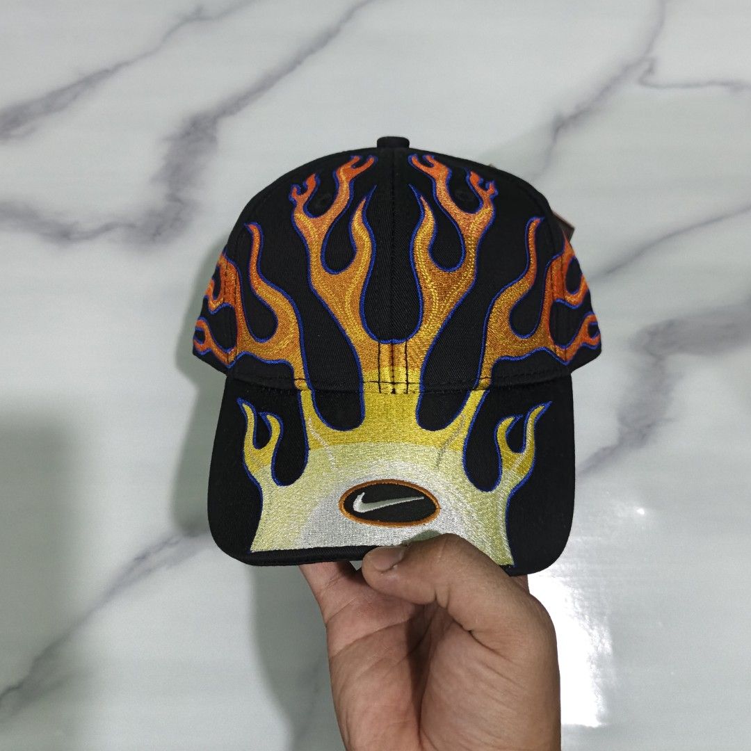 Nike Structured OG Flame Club Cap (High quality Replica) (Category: Caps & Hats) located in Dasmarinas. Submitted by nifty_n00k (Listing ID 1463327120, Image 3). Description: - Black Nike cap - Unique flame embroidery design (yellow, orange, red with blue outlines) - Features the classic Nike swoosh logo - Brand new with original tags attached - Adds a stylish flair to any outfit.