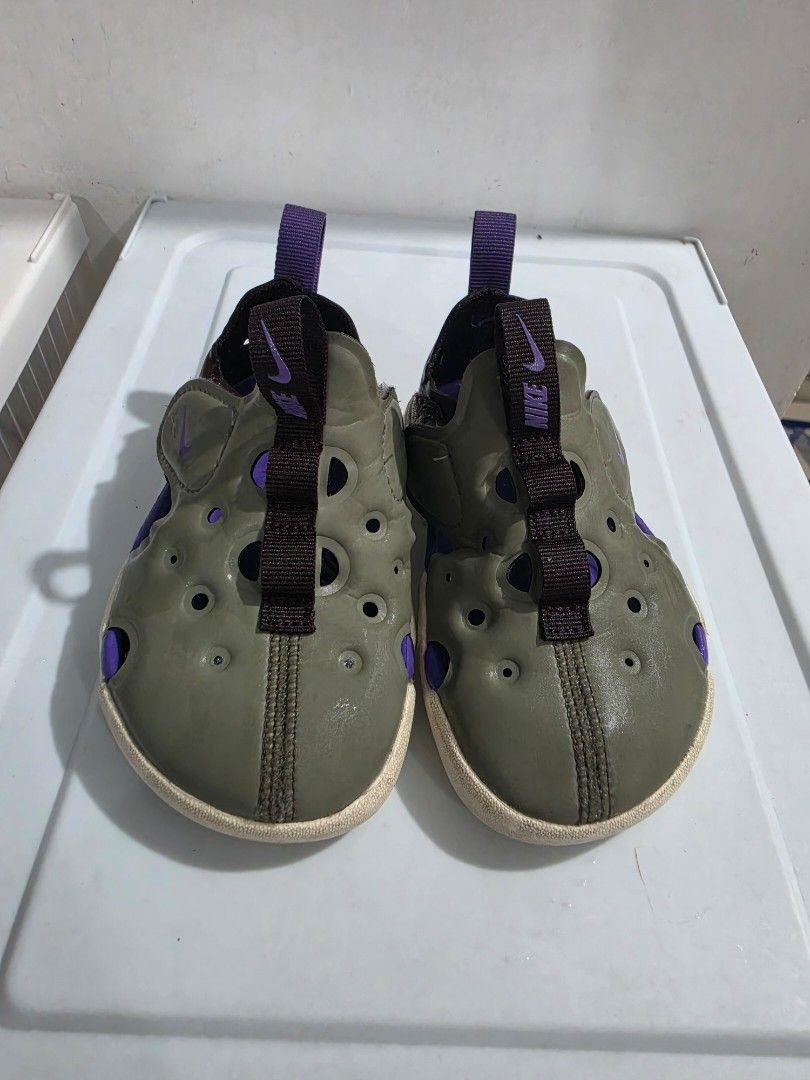 Nike Sunray Protect 4 Sandals (Category: Babies & Kids Fashion) located in Manila. Submitted by shieladmd (Listing ID 1463430954, Image 2). Description: - Nike Sunray Protect 4 Sandals in vibrant green and purple. - Features adjustable straps for a secure and customized fit. - Designed for easy slip-on and slip-off convenience. - Ideal for summer adventures and outdoor play. - Ensures comfort for little feet exploring the great outdoors..