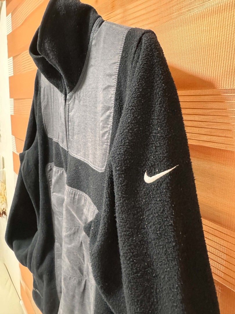 Nike Therma-Fit Fleece Jacket Black (Category: Coats, Jackets and Outerwear) located in Makati City. Submitted by rexb1993 (Listing ID 1463494548, Image 2). Description: - Black Nike Therma-Fit fleece jacket - Contrasting grey panels on front and sleeves - Full zip closure - Stand-up collar - Ideal for layering or as a standalone piece - Shows some signs of wear on the fleece material.