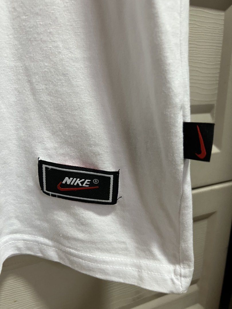 Nike White "Just Do It" T-Shirt (Category: Tshirts & Polo Shirts ) located in Cainta. Submitted by p3spreloved (Listing ID 1463353298, Image 3). Description: - Classic white Nike t-shirt - Features iconic 'Just Do It' graphic - Made from comfortable cotton fabric - Timeless crew neck design - Ideal for everyday wear and casual styling - Check tags for specific size and material details Size S Length 26.5in Width 19in VGUc.