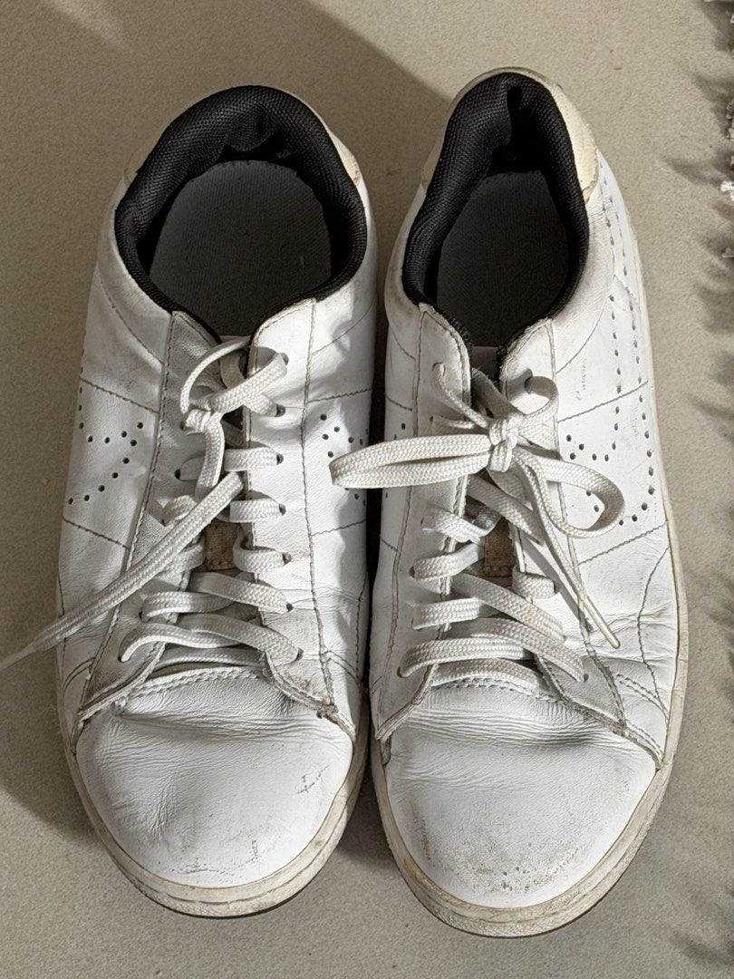Nike White Leather Sneakers (Category: Sneakers) located in Taguig. Submitted by anxmz (Listing ID 1463409828, Image 1). Description: - Classic white Nike sneakers - Genuine leather with perforated details - Lace-up closure for a secure fit - Iconic Nike logo on the heel tab - Versatile for everyday casual outfits.