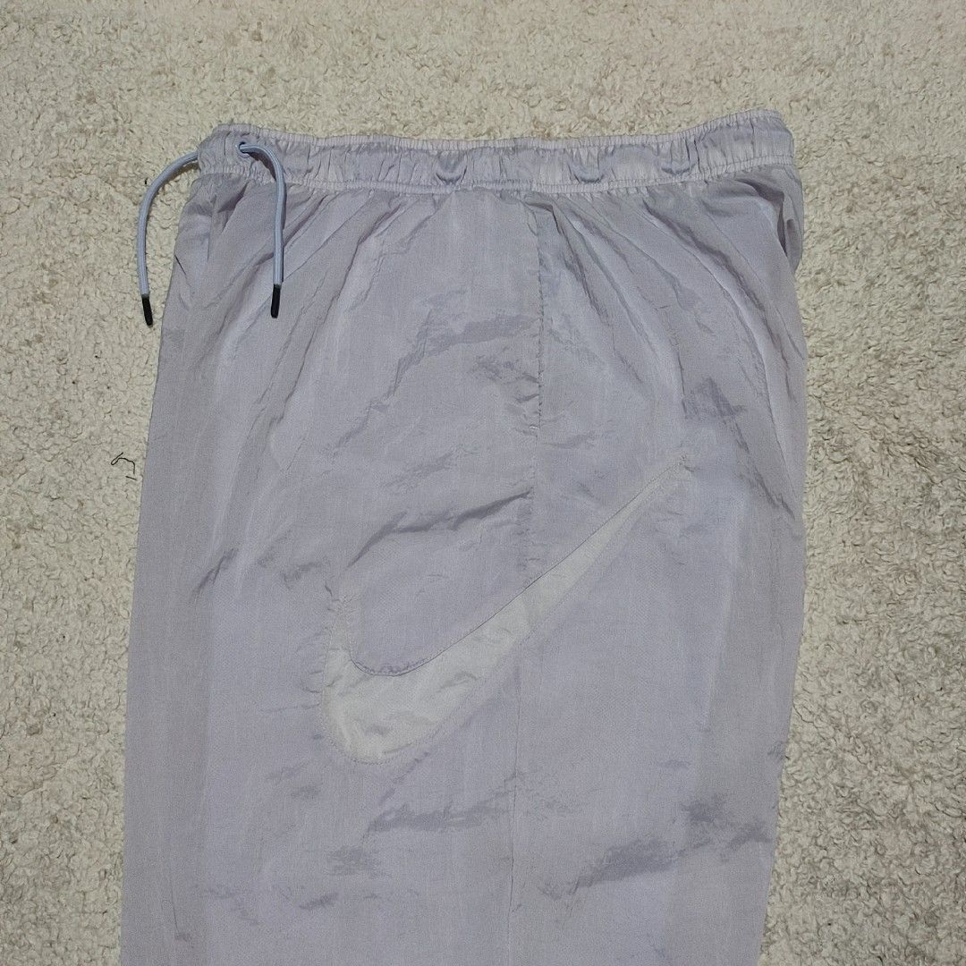 Nike White Windbreaker Track Pants Joggers (Category: Joggers) located in Manila. Submitted by anthonig (Listing ID 1463351908, Image 2). Description: Length: 36 inches Width: 29 inches Hem: 4.5 inches Price: 500 pesos Condition: 9.5/10 Issues: none PM if interested or for inquiries Meetups within MANILA only Can do shipping at buyers expense.
