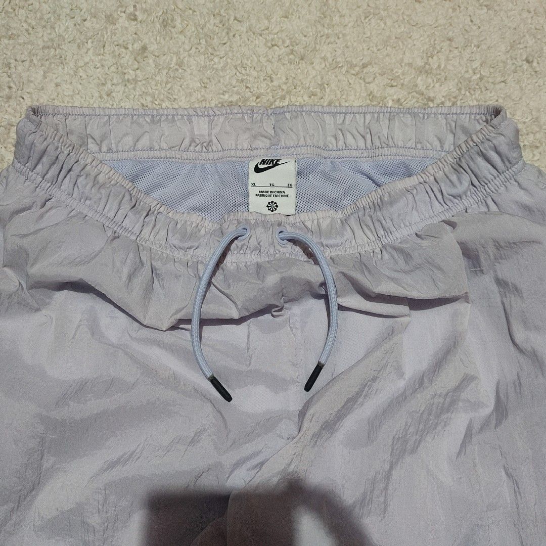 Nike White Windbreaker Track Pants Joggers (Category: Joggers) located in Manila. Submitted by anthonig (Listing ID 1463351908, Image 3). Description: Length: 36 inches Width: 29 inches Hem: 4.5 inches Price: 500 pesos Condition: 9.5/10 Issues: none PM if interested or for inquiries Meetups within MANILA only Can do shipping at buyers expense.