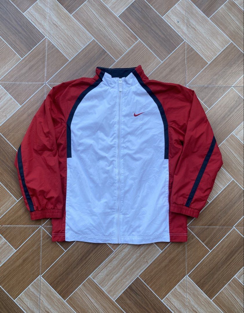 Nike Windbreaker Jacket Red White Blue (Category: Coats, Jackets and Outerwear) located in Davao. Submitted by thirdy.pfp (Listing ID 1463414274, Image 1). Description: Vtg Nike Track Jacket Medium 24 width 27 length 24 sleeves Excellent 500 - Classic Nike windbreaker jacket - Red, white, and black colorway - Full zip closure - Breathable mesh lining - Ideal for everyday wear or light workouts - Size: Medium (M).