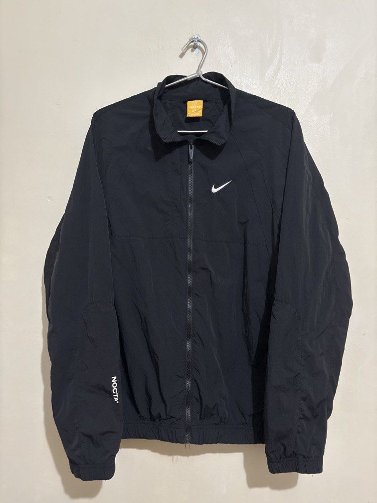 Nike x Nocta Woven Track Jacket (Category: Coats, Jackets and Outerwear) located in Muntinlupa City. Submitted by owrayttttt (Listing ID 1463418127, Image 1). Description: - Authentic Nike x Nocta Woven Track Jacket - XXL on tag - Dimes is 25.5x29 - Complete tags - Minor issue, very minimal crack on the swoosh logo - Free shipping nationwide via j&t.
