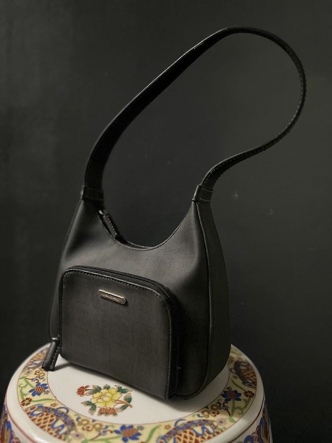 Nine West Black Shoulder Bag (Category: Shoulder Bags) located in Caloocan City. Submitted by zealgem_d3432f (Listing ID 1463528161, Image 1). Description: - Classic black shoulder bag from Nine & Company - Features a convenient front zip pocket - Comfortable strap for easy carrying - Simple and versatile design, ideal for everyday use - Perfectly fits your daily essentials Please feel free to message me if there are any inquiries or requests for