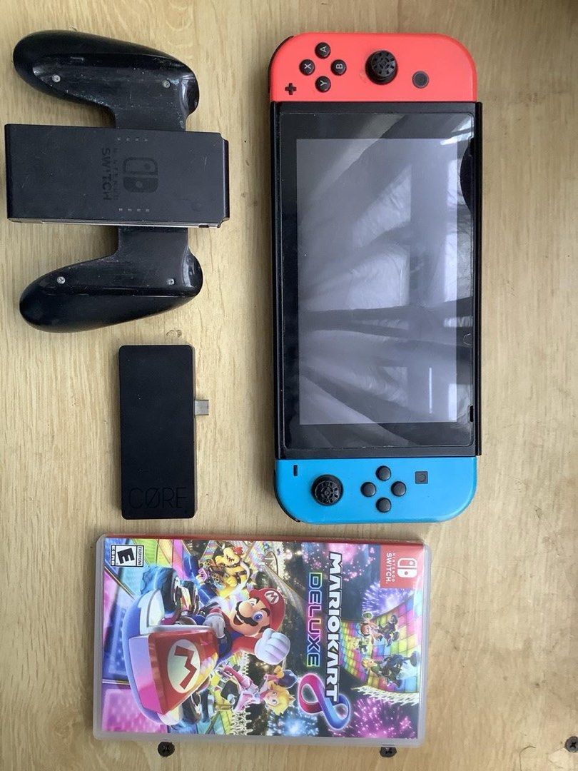 Nintendo Switch V1 (Category: Nintendo) located in Cebu City. Submitted by salmoonthrifts (Listing ID 1463397305, Image 1). Description: rush selling! need for tuition! Nintendo V1 with controller grip, hdmi connector and free mariokart deluxe 8! Issues: joycon drift but cheap fix radaw and no drift if ibutang sa controller grip.