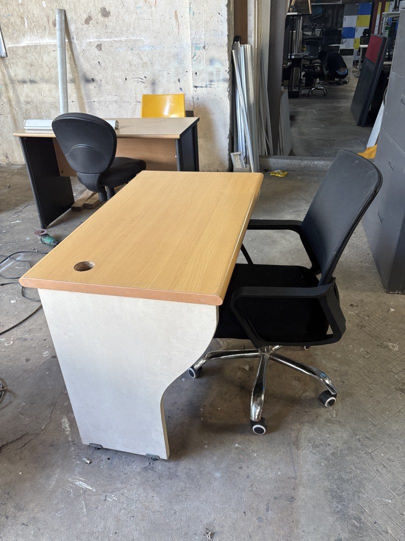 Office Desk with Swivel Chair (Category: Office Furniture & Fixtures) located in Valenzuela. Submitted by cha_leng.861 (Listing ID 1463407482, Image 1). Description: - Office desk and chair set - Desk features light wood laminate top and light base - Includes convenient cable management hole - Chair is a black mesh swivel type with wheels - Ideal for home office or study space - Ready for pickup.
