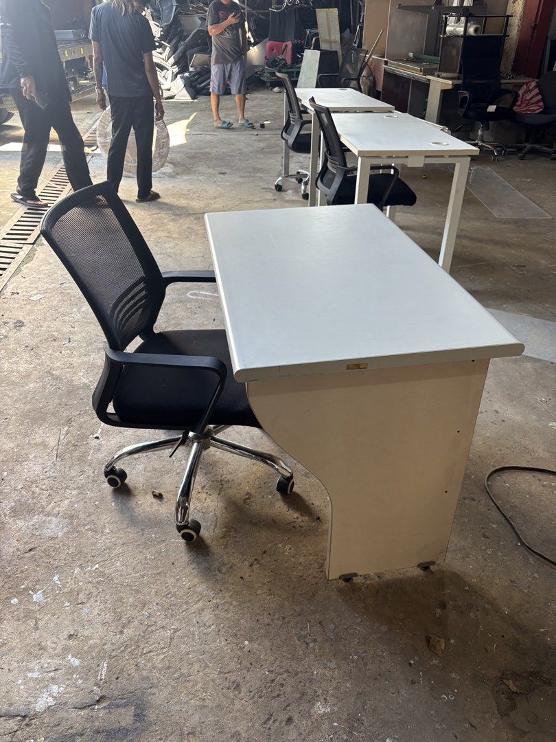 Office Desk with Swivel Chair (Category: Office Furniture & Fixtures) located in Valenzuela. Submitted by cha_leng.861 (Listing ID 1463407580, Image 2). Description: - Complete office desk and chair set - Desk features a light-colored top and cream base - Includes a black mesh swivel chair with wheels - Ideal for home office or study setup - Ready for pickup.