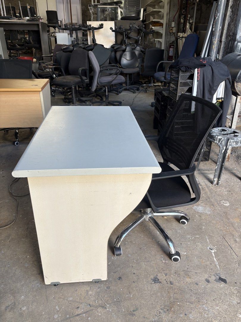 Office Desk with Swivel Chair (Category: Office Furniture & Fixtures) located in Valenzuela. Submitted by cha_leng.861 (Listing ID 1463407580, Image 1). Description: - Complete office desk and chair set - Desk features a light-colored top and cream base - Includes a black mesh swivel chair with wheels - Ideal for home office or study setup - Ready for pickup.