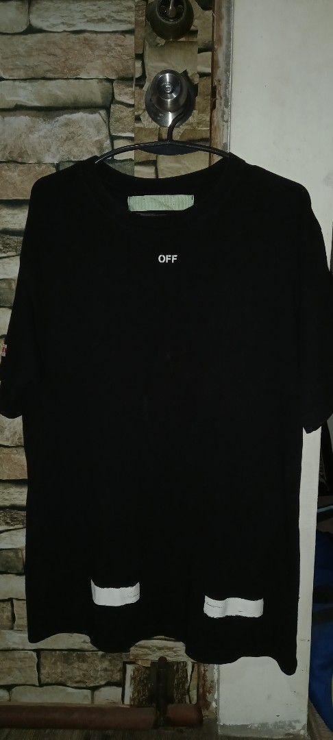 OFF-WHITE Black T-Shirt (Category: Tshirts & Polo Shirts ) located in Cavite. Submitted by chard112345 (Listing ID 1463548396, Image 2). Description: - OFF-WHITE black t-shirt. - Features the iconic OFF-WHITE diagonal arrows graphic on the front. - Small 'OFF' logo detail on the chest. - Tag details are visible in the provided photos. - A must-have addition to any streetwear collection..