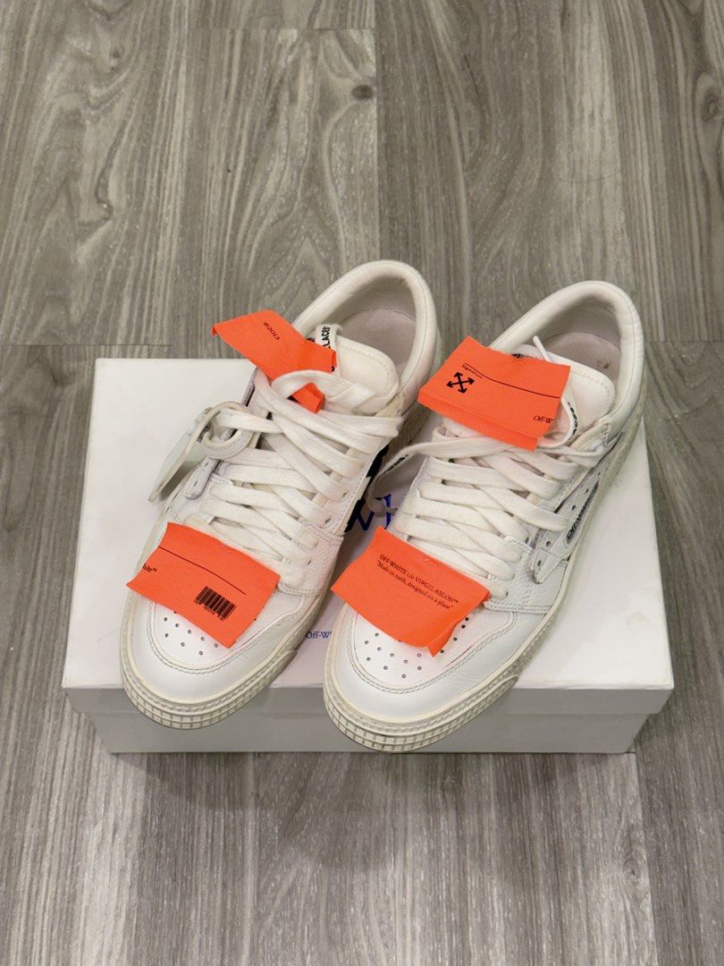 Off-White Low Vulcanized Sneakers White (Category: Sneakers) located in Manila. Submitted by silent_dosss (Listing ID 1463379326, Image 2). Description: - Authentic Off-White Low Vulcanized sneakers - Classic white leather design - Features iconic orange tag detail - Includes original Off-White box - Essential streetwear staple.