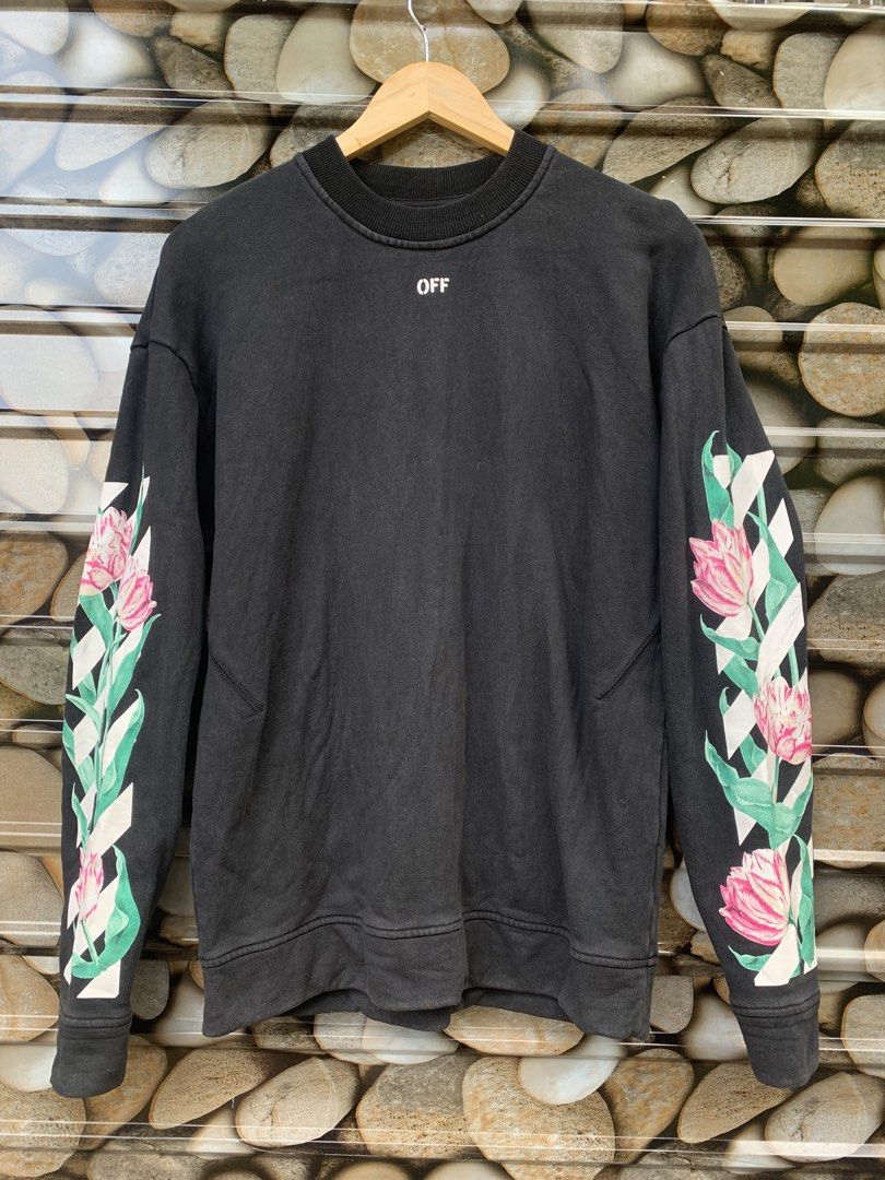 OFF-WHITE "Main Label" Floral Print Sweatshirt (Category: Coats, Jackets and Outerwear) located in Aloran. Submitted by chester78864 (Listing ID 1463492133, Image 2). Description: - Authentic OFF-WHITE black sweatshirt - Size: Medium (M) - Iconic arrow logo with floral print on the back - Floral and stripe design on the sleeves - "OFF" logo detail on the front - "MAIN LABEL" and "2013" tag details.