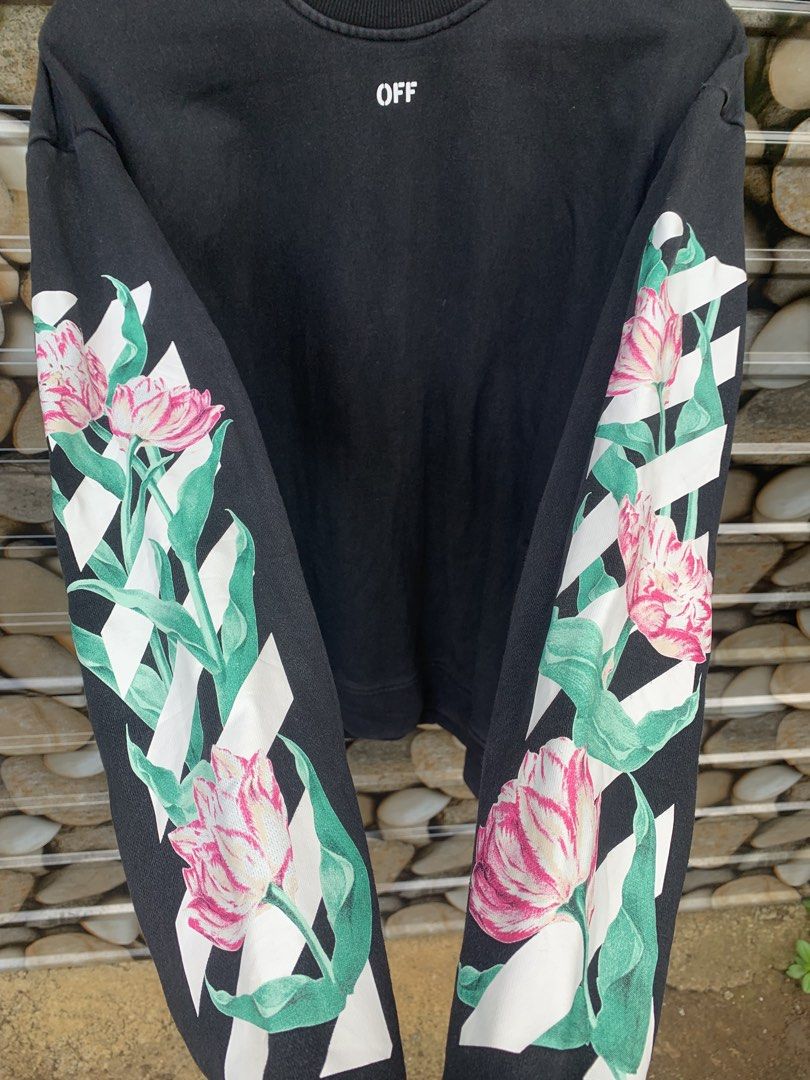 OFF-WHITE "Main Label" Floral Print Sweatshirt (Category: Coats, Jackets and Outerwear) located in Aloran. Submitted by chester78864 (Listing ID 1463492133, Image 3). Description: - Authentic OFF-WHITE black sweatshirt - Size: Medium (M) - Iconic arrow logo with floral print on the back - Floral and stripe design on the sleeves - "OFF" logo detail on the front - "MAIN LABEL" and "2013" tag details.