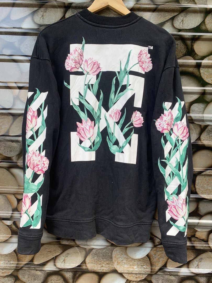 OFF-WHITE "Main Label" Floral Print Sweatshirt (Category: Coats, Jackets and Outerwear) located in Aloran. Submitted by chester78864 (Listing ID 1463492133, Image 1). Description: - Authentic OFF-WHITE black sweatshirt - Size: Medium (M) - Iconic arrow logo with floral print on the back - Floral and stripe design on the sleeves - "OFF" logo detail on the front - "MAIN LABEL" and "2013" tag details.