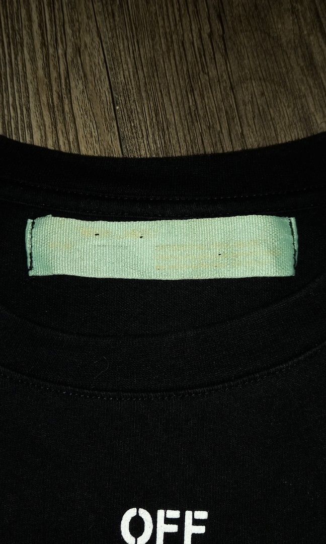 OFF-WHITE "Seeing Things" (Category: Tshirts & Polo Shirts ) located in Imus. Submitted by pampie (Listing ID 1463547931, Image 3). Description: - Black OFF-WHITE T-Shirt - Iconic Arrow Graphic - "Seeing Things" Text Detail - Size: M-L (fits Medium to Large) - Measurements: 20" Width x 29" Length - Condition: Great, well-maintained - Ready for its new owner!.