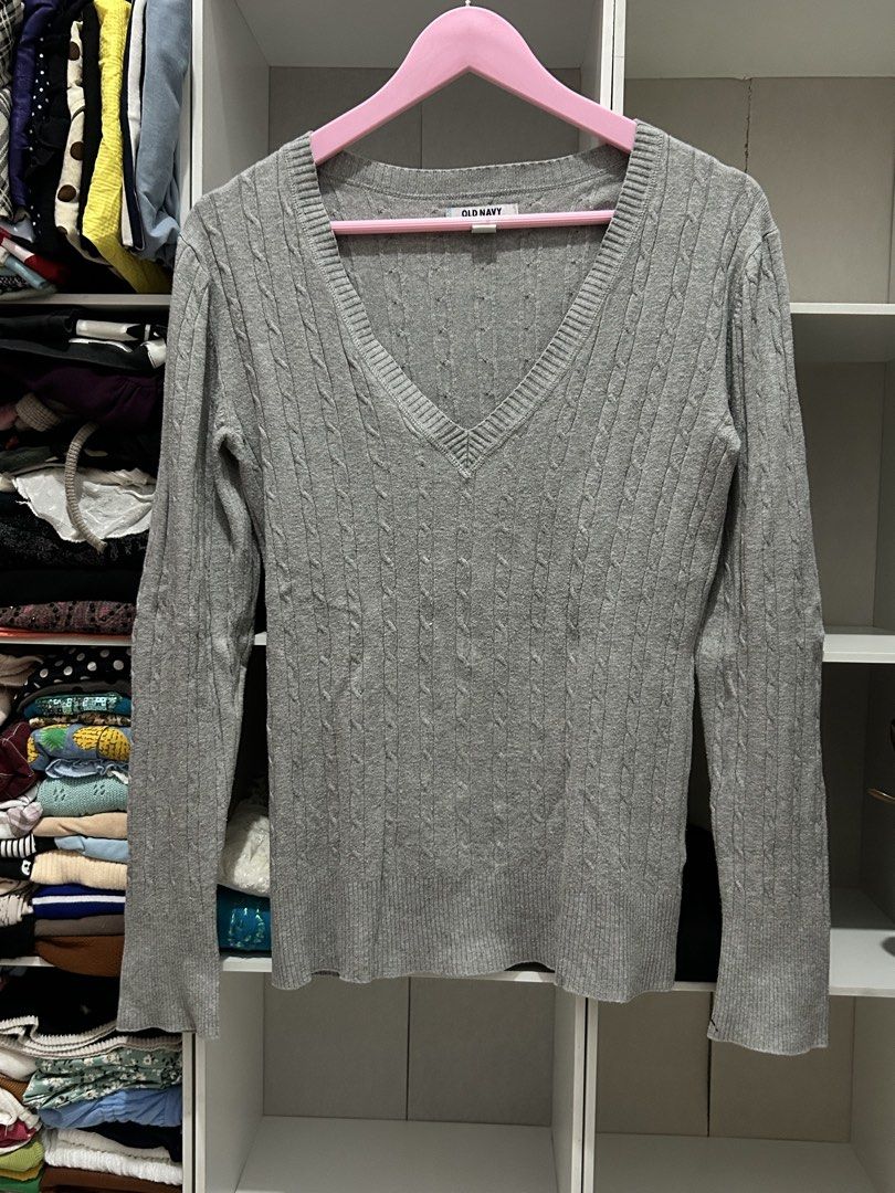 Old Navy Y2k Grey Cable Knit V-Neck Sweater (Category: Coats, Jackets and Outerwear) located in Batangas. Submitted by nommi26 (Listing ID 1463402580, Image 2). Description: - Grey cable knit sweater - Brand: Old Navy - V-neckline - Long sleeves - Size: Medium - Comfortable and versatile - Easy to pair with jeans or skirts.