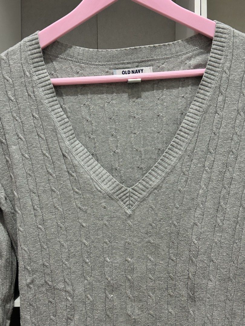 Old Navy Y2k Grey Cable Knit V-Neck Sweater (Category: Coats, Jackets and Outerwear) located in Batangas. Submitted by nommi26 (Listing ID 1463402580, Image 3). Description: - Grey cable knit sweater - Brand: Old Navy - V-neckline - Long sleeves - Size: Medium - Comfortable and versatile - Easy to pair with jeans or skirts.
