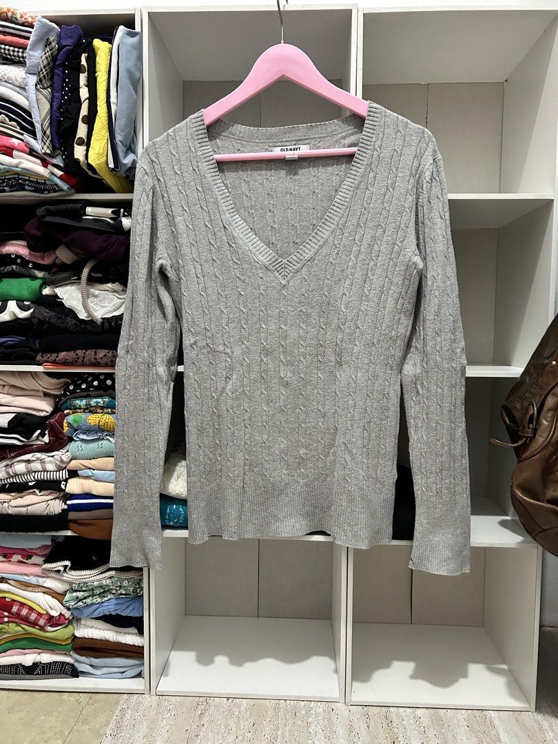 Old Navy Y2k Grey Cable Knit V-Neck Sweater (Category: Coats, Jackets and Outerwear) located in Batangas. Submitted by nommi26 (Listing ID 1463402580, Image 1). Description: - Grey cable knit sweater - Brand: Old Navy - V-neckline - Long sleeves - Size: Medium - Comfortable and versatile - Easy to pair with jeans or skirts.
