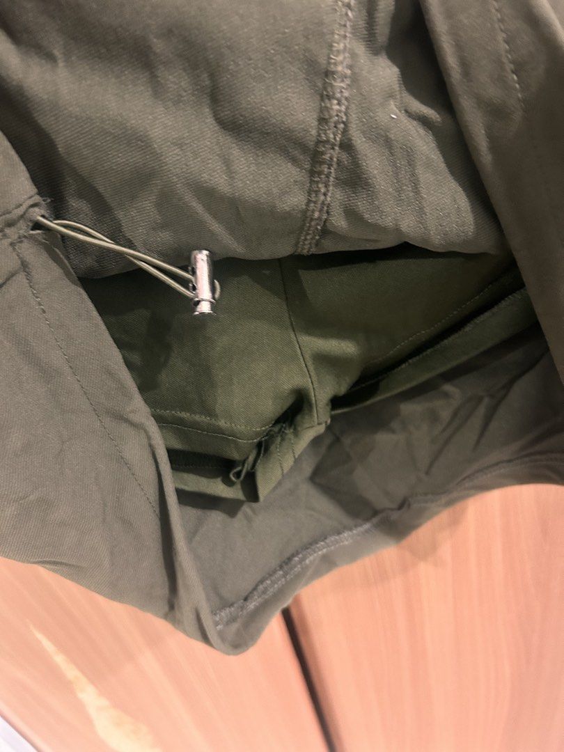 Olive Green Cargo Mini Skirt with Drawstring Waist (Category: Skirts) located in Taguig. Submitted by peanutcoconut (Listing ID 1463484930, Image 3). Description: - Cute olive green cargo mini skirt - Stretchy drawstring waist for a comfy fit - Two side pockets and two front flap pockets - Drawstring hem for adjustable fit - Ideal for casual outfits.