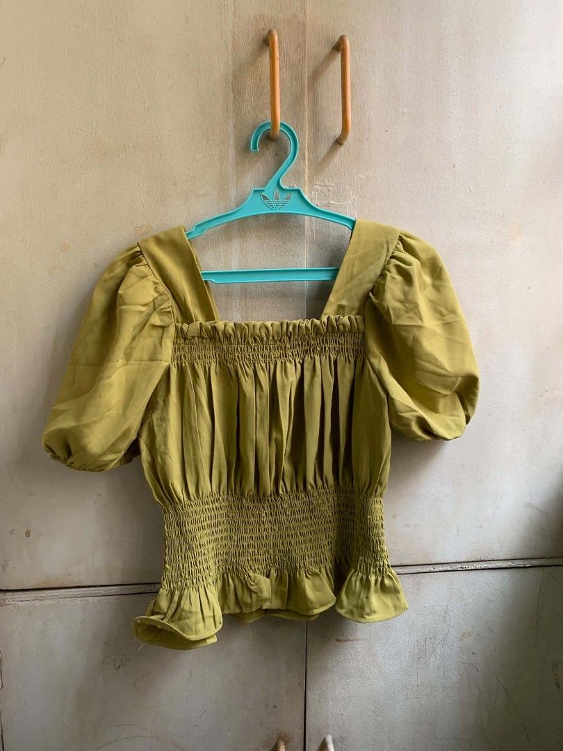 Olive Green Smocked Puff Sleeve Square Neck Top (Category: Blouses) located in Manila. Submitted by usagichan_rabbit (Listing ID 1463341063, Image 1). Description: small size - Cute olive green top - Smocked bodice - Puff sleeves - Square neckline - Ruffled hem detail - Perfect for dressing up or down - Easy to pair with jeans or skirts.
