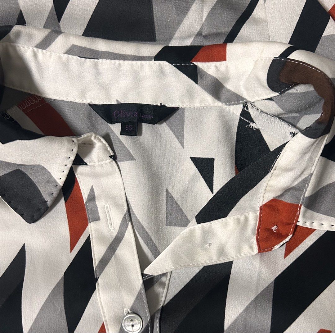 OLIVIA LAUREN (Category: Longsleeves) located in Davao. Submitted by sart0ria85 (Listing ID 1463369340, Image 2). Description: A geometric pattern of orange gray and black. Label is no longer clear. SMALL. Size 4 EXCELLENT CONDITION (95/100).