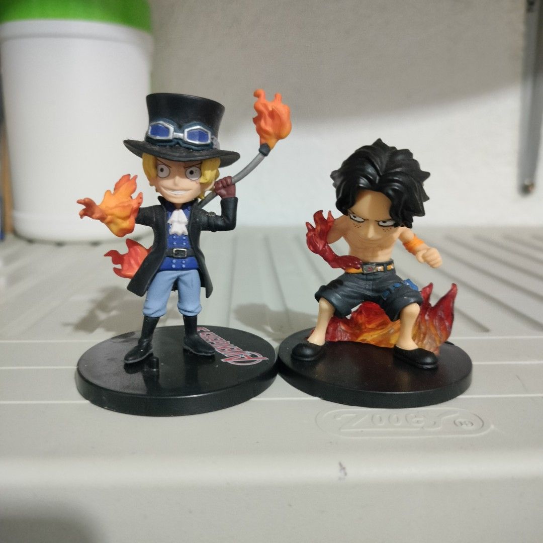 One Piece Ace & Sabo Action Figures Set (Category: Figurines & Statues) located in Plaridel. Submitted by klayskolektibols (Listing ID 1463499509, Image 1). Description: - Set of 2 One Piece action figures - Features Ace and Sabo - Both figures have dynamic fire effects - Ideal for any One Piece fan's collection - Can be displayed together or individually - Each figure comes with its own base.
