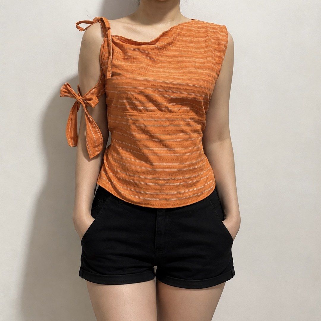 Orange Striped One-Shoulder Tie Top (Category: Sleeveless) located in Caloocan City. Submitted by irstmr (Listing ID 1463508859, Image 1). Description: upcycled top made of thrifted polo shirt 🧡 important note: have a unnoticeable white stain at the back visit @missfitsmnl on IG for more.
