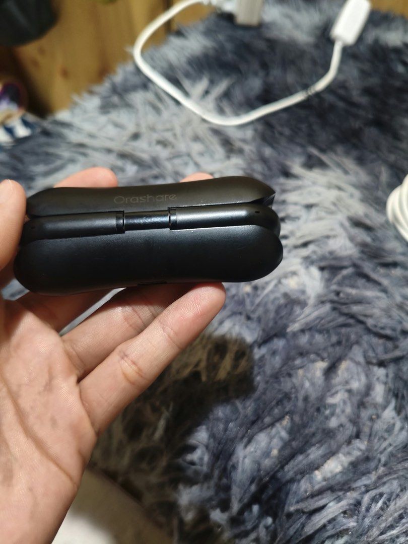 orashare Wireless Earbuds with Charging Case (Category: Earphones) located in Manila. Submitted by thriftnivee (Listing ID 1463432483, Image 2). Description: - Orashare Wireless Earbuds - Color: Black - Includes charging case - Includes USB cable - All items included in the box - Ready for immediate use.