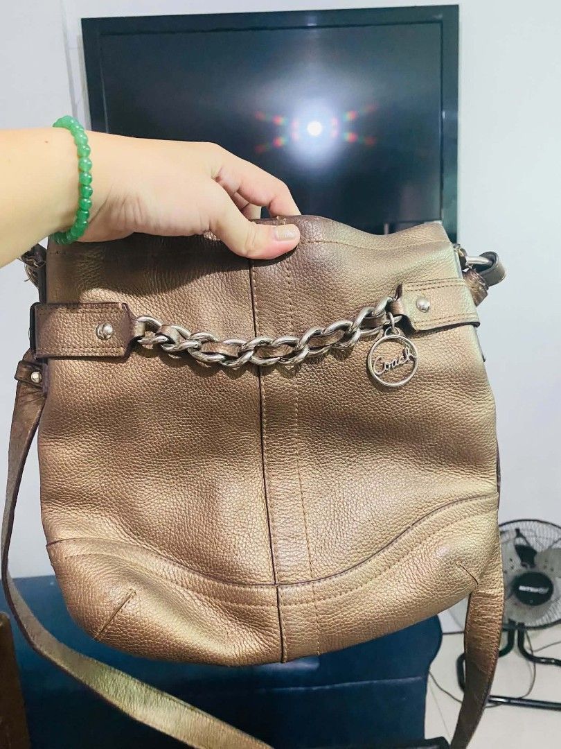 Original Coach messenger bag (Category: Cross-body Bags) located in Manila. Submitted by katzzaye (Listing ID 1463400424, Image 1). Description: genuine leather crossbody bag with bronze brown actual color. still presentable and good quality bag freebie awaits message me no return no exchange po salamat.
