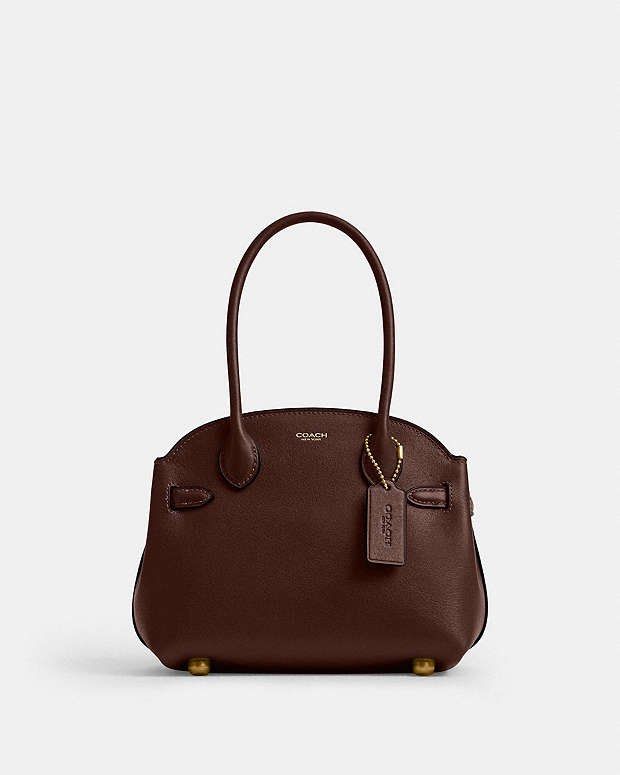 💯ORIGINAL COACH SOFT EMPIRE CARRYALL 21 MAPLE (Category: Cross-body Bags) located in Quezon City. Submitted by ashongsstore (Listing ID 1463342622, Image 2). Description: ✨ C0ACH COLLECTION ✨ 🇵🇭AVAILABLE🇵🇭 Soft Empire Carryall Bag 21 A vintage-inspired silhouette, our Empire Carryall is designed with a New York state of mind—and attitude. Crafted of natural grain leather with a beautiful texture and soft feel, the compact 21 features a multi