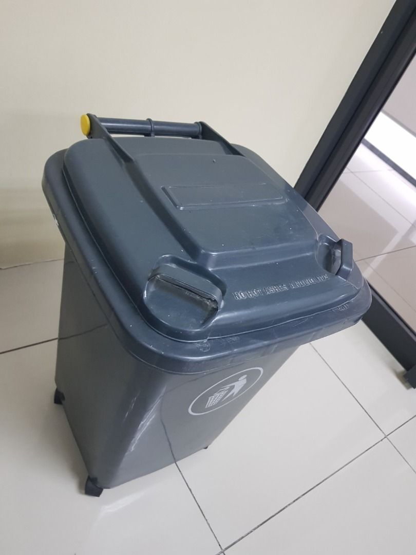 Outdoor Recycle Trash Can Plastic Garbage Bins Waste Trash Bin (Category: Waste Bins & Bags) located in Quezon City. Submitted by midaceph (Listing ID 1463396143, Image 2). Description: - Grey trash bin with wheels and lid - Features a recycling symbol on the front - Yellow accent handle on the lid - Ideal for home or office use - Easy to move around to wheels - Approximate dimensions: [insert dimensions if known].