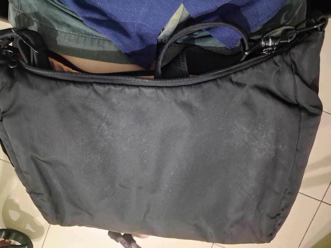 Pacsafe Black Crossbody Bag RFID Safe (Category: Cross-body Bags) located in Mandaluyong City. Submitted by gantan.tree (Listing ID 1463516645, Image 2). Description: - Brand: Pacsafe - Type: Black Crossbody Bag - Security: RFID blocking technology - Organization: multiple interior compartments - Exterior: front zip pocket, adjustable strap - Condition: good, with minor exterior marks - Ideal for: travel, laptop use Price negotiable, name your pr