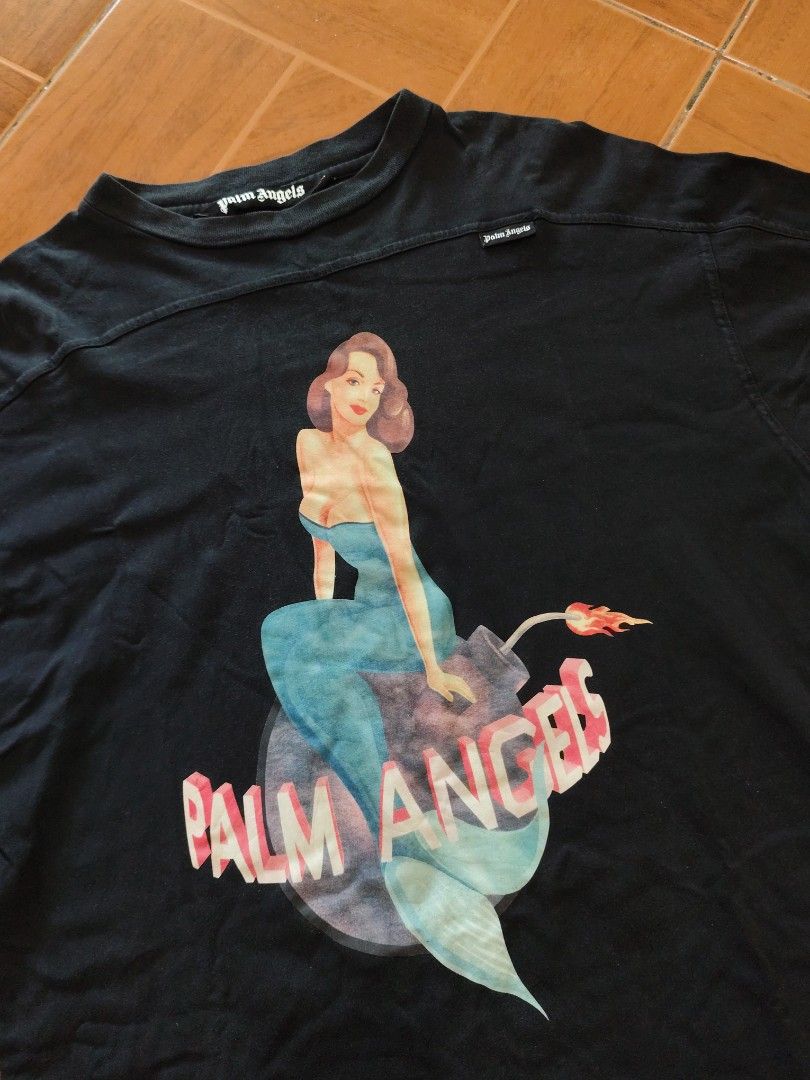 PALM ANGELS MERMAID 💣 (Category: Tshirts & Polo Shirts ) located in Angeles City. Submitted by kalben10 (Listing ID 1463330718, Image 3). Description: PALM ANGELS MERMAID 💣 Condition: Good Dimes: 22.5x29 Issue: minimal pilling Dm for more details 📩.