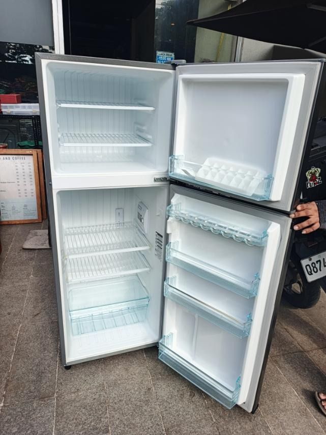 Panasonic Two-Door Refrigerator (Category: Refrigerators and Freezers) located in San Pedro. Submitted by cgi.saversplustrading (Listing ID 1463347859, Image 2). Description: - Panasonic two-door refrigerator inverter - Top freezer, bottom fridge - Plenty of shelf space - Sleek grey exterior - Works well - Ideal for small spaces or as a secondary fridge.