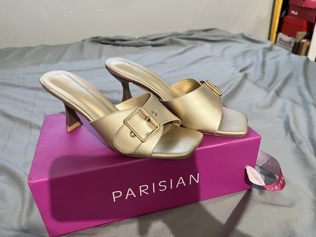 PARISIAN Gold Sandals (Category: Heels) located in Manila. Submitted by evies.prlvd (Listing ID 1463351488, Image 1). Description: Decluttering my Parisian heels, used once only for event - Brand: PARISIAN - Style: Gold Heeled Mules - Design: Square toe with gold buckle detail.