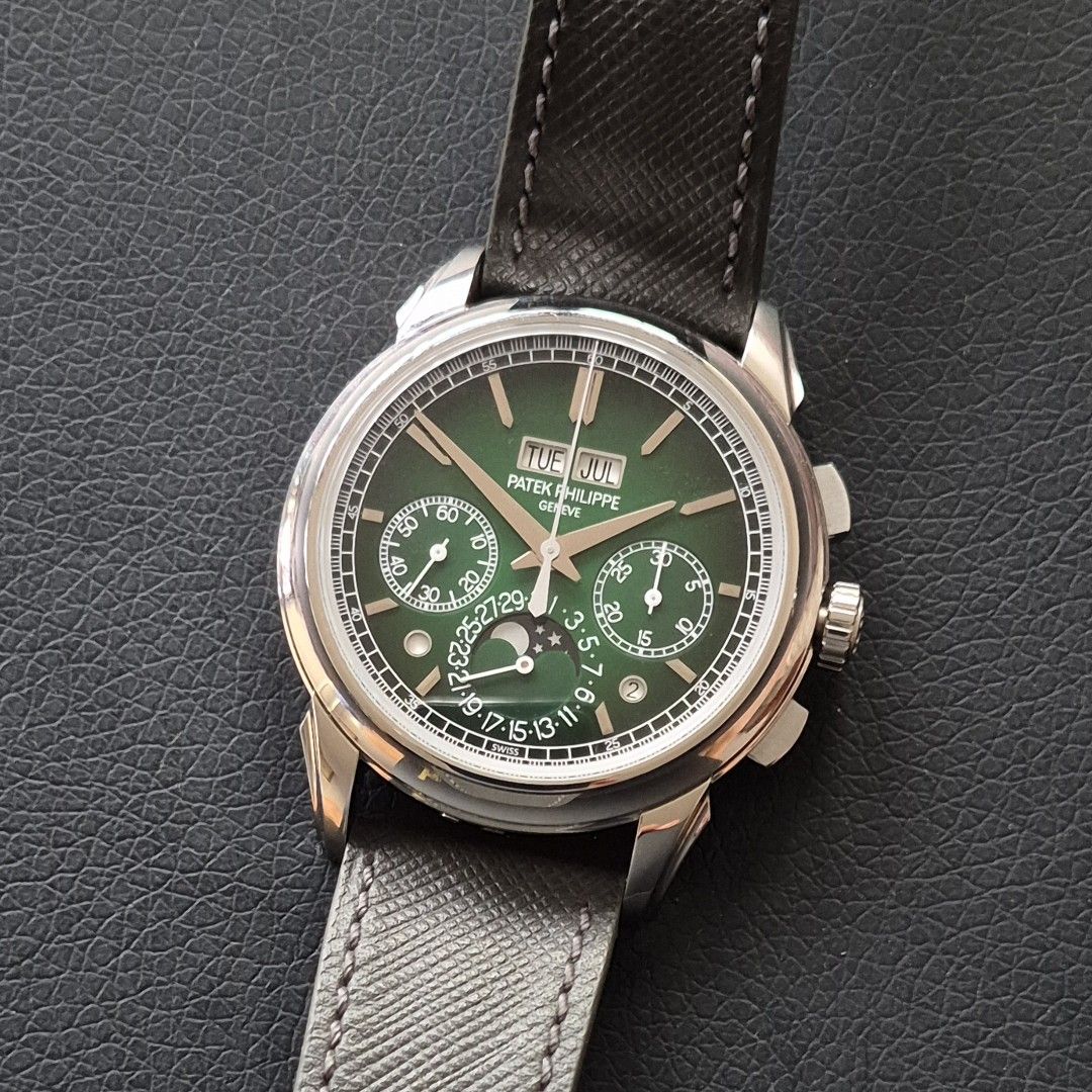Patek Philippe 5270P-014 (Category: Watches) located in Singapore. Submitted by goh7777 (Listing ID 1463395101, Image 2). Description: Patek Philippe 5270P-014 Perpetual Calendar Chronograph in mint condition and under factory warranty until 2029 for sale. Full set with US AD stamped Certificate of Origin (dated Aug-2024), envelope, solid case back, stylus, leather folder, manuals, cleaning cloth, wooden box and outer boxes. Fitted on an aftermar