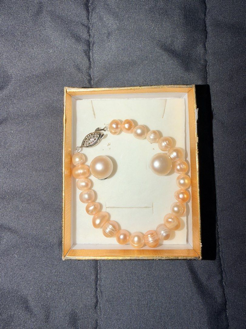 Peach Pearl Bracelet only with Silver Clasp (Category: Bracelets) located in Taguig. Submitted by myownstuff_mitch (Listing ID 1463431585, Image 1). Description: - Beautiful peach pearl bracelet only - Bracelet features a silver clasp adorned with small stones. - Pearls boast a lovely luster and natural variation in shape and size. - Arrives in a gift box, perfect for gifting. - Adds a touch of elegance to any outfit..