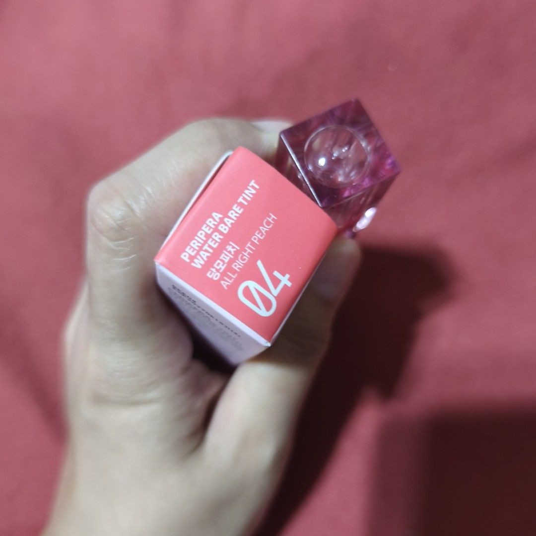 Peripera Water Bare Tint 04 All Right Peach (Category: Makeup) located in Valenzuela. Submitted by peanutsonlineshop (Listing ID 1463467588, Image 3). Description: Peripera Water Bare Tint 04 All Right Peach. Lightweight, water-based tint for a natural, glossy peach lip look. Cute, compact packaging. Selling as I have too many lip products..