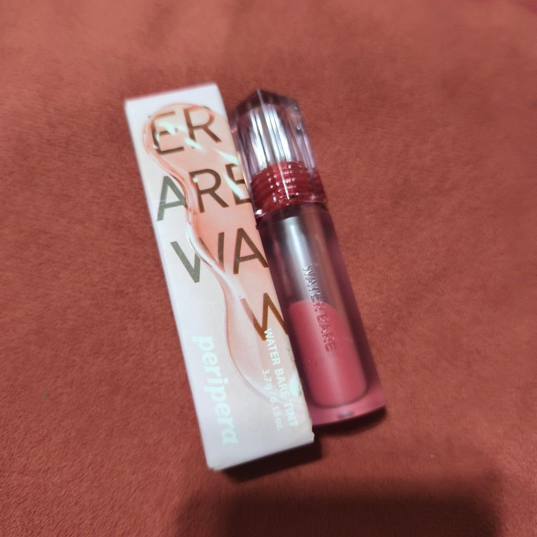 Peripera Water Bare Tint 04 All Right Peach (Category: Makeup) located in Valenzuela. Submitted by peanutsonlineshop (Listing ID 1463467588, Image 1). Description: Peripera Water Bare Tint 04 All Right Peach. Lightweight, water-based tint for a natural, glossy peach lip look. Cute, compact packaging. Selling as I have too many lip products..