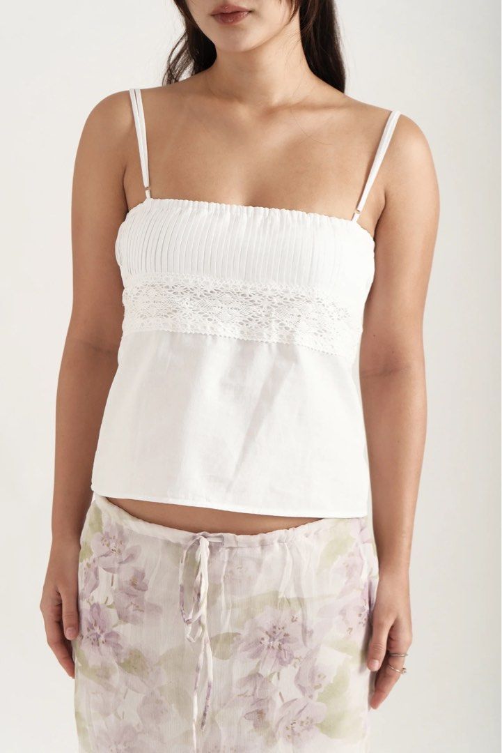Phia The Label White Anna Two Way Top (Category: Sleeveless) located in Manila. Submitted by morningkofi (Listing ID 1463421568, Image 2). Description: - On Hand, Brand new! only fitted - Selling for how much i bought it for - currently on pre order on the website - Size: S - rfs: wrong size best-selling two-way top - the Anna top. Features a pleated bust, with delicate floral cotton lace. Made of 100% Cotton. Designed for comfort and breathabili
