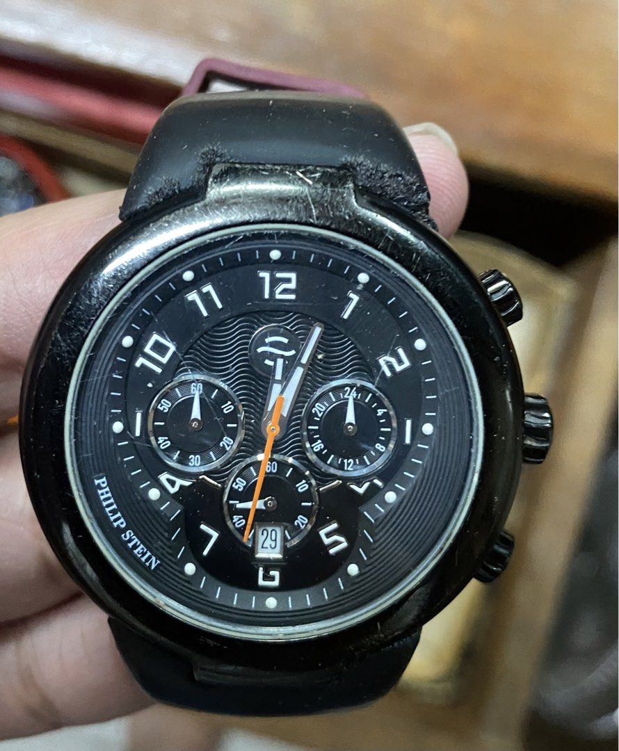 Philip Stein Quartz watch (Category: Men's Watches) located in Marikina City. Submitted by angelinigo12 (Listing ID 1463501975, Image 1). Description: - Brand: Philip Stein - Type: Quartz Watch - Dial Color: Black with orange accents - Features: Chronograph, Date display - Water Resistance: 10 ATM - Material: Stainless Steel case back Issues: Strap needs replacing ang visible scratches.