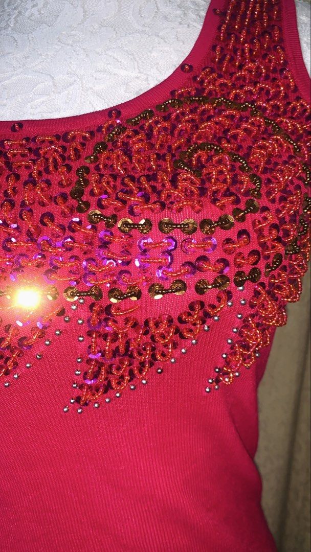 Pink Beaded Sequin Tank Top (Category: Sleeveless) located in Dagupan City. Submitted by sj_styles0910. (Listing ID 1463533366, Image 3). Description: - Vibrant bright pink tank top - Features a gorgeous beaded and sequined neckline - Embellishments include shades of red, pink, and gold - Made with ribbed fabric for a flattering fit - Perfect for dressing up or down.