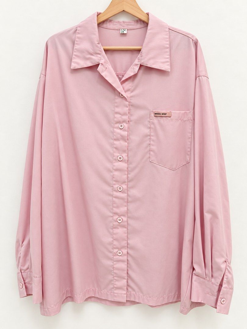 Pink Button-Up Longsleeves (Category: Shirts) located in Manila. Submitted by marieladea47607 (Listing ID 1463463324, Image 1). Description: - Pink long-sleeve button-up shirt - Features a chest pocket - Button cuffs - Relaxed fit - Ideal for casual outfits or layering - Color may vary due to lighting.