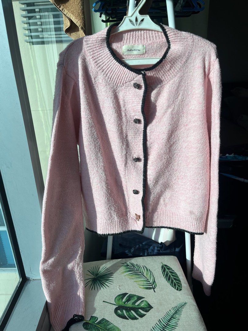 Pink Knit Cardigan Two Tone (Category: Coats, Jackets and Outerwear) located in Manila. Submitted by formyfunds (Listing ID 1463532219, Image 1). Description: Hindi makati 💖 Small to large (stretchy material) Best fit small to semi large para di gaano fit. - Pink Two Toned knit cardigan - 🐱Adorable button details - Long sleeves with ribbed cuffs - Cozy and stylish, ideal for layering.
