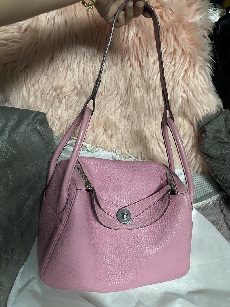 Pink Leather Handbag with Shoulder Strap (Category: Shoulder Bags) located in Manila. Submitted by aisasalvad24335 (Listing ID 1463496094, Image 1). Description: - Cute pink leather handbag - Features both shoulder strap and top handles - Secure zipper closure on top - Protective metal feet on the bottom - Spacious interior, ideal for everyday essentials - Versatile for daily use.