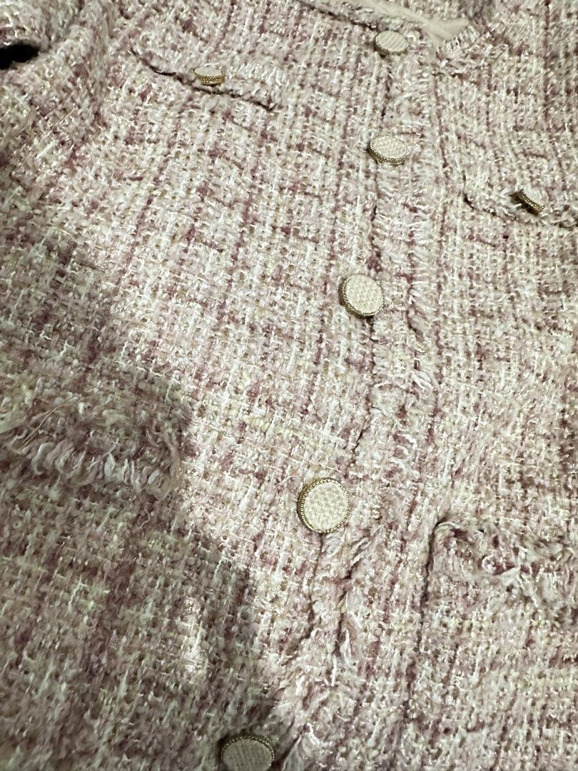 Pink Tweed Jacket with Button Detail (Category: Coats, Jackets and Outerwear) located in Manila. Submitted by everythingsale101 (Listing ID 1463470802, Image 2). Description: - Adorable pink tweed jacket - Classic collarless design - Button closures - Trendy frayed hem for added texture - Multiple front pockets - Versatile for casual (with jeans) or dressed-up looks - Ideal for layering Fits M-L (up to 38 bust) -Premium Tweed Blazers bundle avail